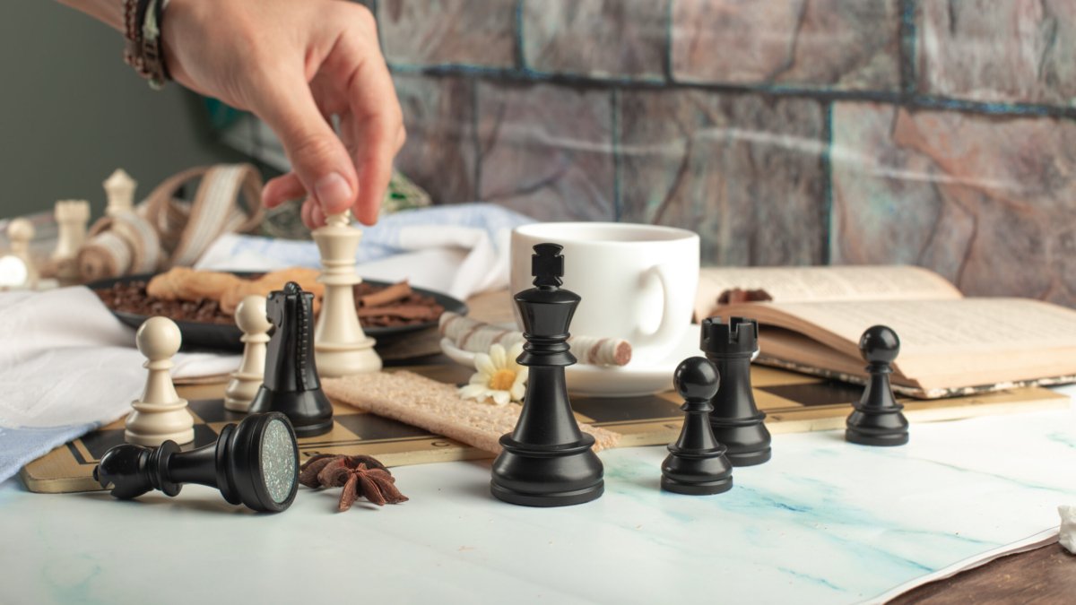 A player playing chess on the table