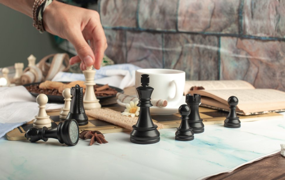 A player playing chess on the table